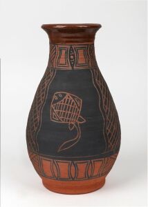 ROBERT EDWARD PURUNTATAMERI brown and black matte glazed pottery vase with sgraffito stingray and barramundi decoration, 27cm high