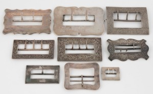 Nine assorted antique and vintage silver belt buckles including examples by FINCKH, DENIS BROTHERS, K & Co. and others, 19th/20th century, (9 items), the largest 9.5cm high, 256 grams total