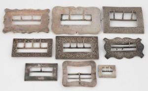 Nine assorted antique and vintage silver belt buckles including examples by FINCKH, DENIS BROTHERS, K & Co. and others, 19th/20th century, (9 items), ​​​​​​​the largest 9.5cm high, 256 grams total