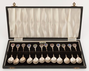 A boxed set of 12 sterling silver and enamel souvenir teaspoons, made in Birmingham, circa 1970s, 174 grams total
