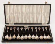 A boxed set of 12 sterling silver and enamel souvenir teaspoons, made in Birmingham, circa 1970s, ​​​​​​​174 grams total