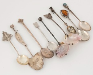 Nine assorted Australian silver spoons and servers decorated with Tasmanian maps, shells, opal, amber, cockatoo finial, Norfolk pine, gum leaf, etc. Makers include GOLDING of Tasmania, PROUDS of Sydney, and SARGISONS of Hobart, the largest 14.5cm, 