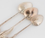 Twelve assorted Australian silver spoons with wildflower motifs, 20th century, ​​​​​​​the largest 12.5cm long, 144 grams total - 2