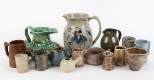 Fifteen assorted pottery jugs including unusual hand-built green example with applied flannel flowers, ​​​​​​​the largest 22cm high