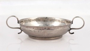 An 18th century CHANNEL ISLANDS silver christening cup in the Jersey style by GUILLAUME HENRY of Guernsey, circa 1720, engraved "M.D.I.", 3.5cm high, 13cm wide, 46 grams