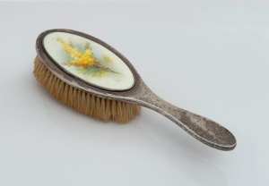 An antique sterling silver hair brush with Australian wattle porcelain panel most likely ROYAL WORCESTER (painted by AUSTIN), made in Chester, circa 1914, retailed by FLAVELLE BROS. of Sydney, 25cm high
