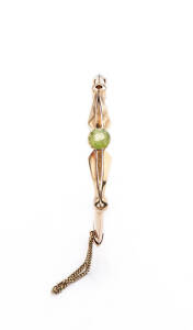 BANGLE: 15ct gold and peridot bangle. 12.30 grams.