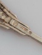 LINTON of Perth set of six Australian silver coffee spoons, two teaspoons, and a pâté knife, all decorated with Western Australian wildflowers, (9 items), stamped "JAL SILVER", the knife 12.5cm long, 100 grams total - 4