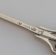 LINTON of Perth set of six Australian silver coffee spoons, two teaspoons, and a pâté knife, all decorated with Western Australian wildflowers, (9 items), stamped "JAL SILVER", the knife 12.5cm long, 100 grams total - 5