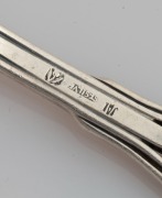 LINTON of Perth set of six Australian silver coffee spoons, two teaspoons, and a pâté knife, all decorated with Western Australian wildflowers, (9 items), stamped "JAL SILVER", the knife 12.5cm long, 100 grams total - 6