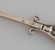 LINTON of Perth set of six Australian silver coffee spoons, two teaspoons, and a pâté knife, all decorated with Western Australian wildflowers, (9 items), stamped "JAL SILVER", the knife 12.5cm long, 100 grams total - 8