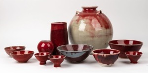 Eleven assorted Australian studio pottery bowls and vases with sang-de-boeuf style glazes, including GEOFF CRISPIN, the largest 28cm high