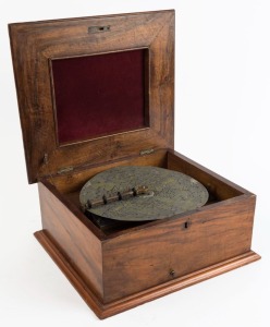 An antique polyphon music player in walnut case with floral marquetry top, late 19th century, 18cm high, 40cm wide, 36cm deep