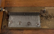 An antique polyphon music player in walnut case with floral marquetry top, late 19th century, 18cm high, 40cm wide, 36cm deep - 4