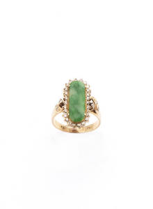RING: 18ct yellow gold, jade and diamond ring. 6.69 grams.