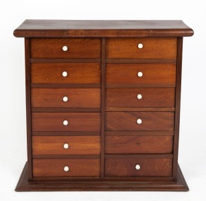 An antique Australian cedar chest of twelve drawers with white porcelain knobs, New South Wales origin, 19th century, 75cm high, 75cm wide, 30cm deep