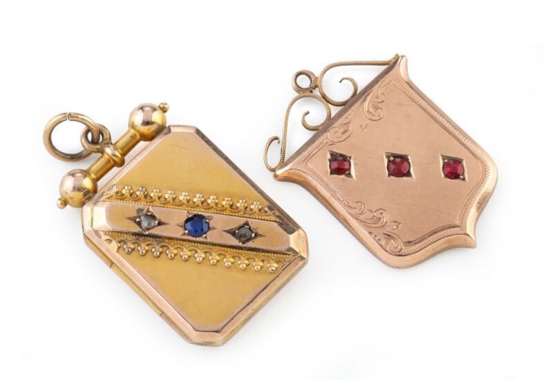 WILLIS & SONS of Melbourne, two antique 9ct gold lockets, the larger, set with a sapphire and two diamonds, the other with red stones, 19th century, (2 items), both stamped "9" flanked by pictorial marks, the larger 4cm high overall, 14.2 grams total