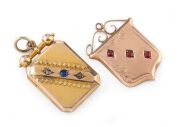 WILLIS & SONS of Melbourne, two antique 9ct gold lockets, the larger, set with a sapphire and two diamonds, the other with red stones, 19th century, (2 items), both stamped "9" flanked by pictorial marks, the larger 4cm high overall, 14.2 grams total