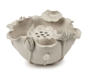An antique Chinese blanc de chine porcelain lotus bowl with flower aid insert, Qing Dynasty, 19th century, 12cm high, 20cm wide