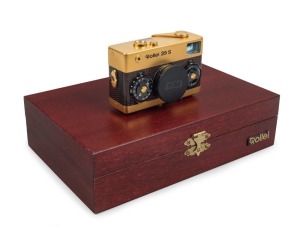 FRANKE & HEIDECKE: 1979 Rollei 35S 35mm compact camera. Special edition gold-plated for the 60th anniversary of the Rollei company [#0036/1500]. In addition to being plated in 24-carat gold, the body is covered in lizard skin, bearing a uniquely numbered 