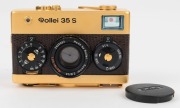 FRANKE & HEIDECKE: 1979 Rollei 35S 35mm compact camera. Special edition gold-plated for the 60th anniversary of the Rollei&nbsp;company [#0036/1500]. In addition to being plated in 24-carat gold, the body is covered in lizard skin, bearing a uniquely numbered - 3