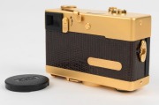 FRANKE & HEIDECKE: 1979 Rollei 35S 35mm compact camera. Special edition gold-plated for the 60th anniversary of the Rollei&nbsp;company [#0036/1500]. In addition to being plated in 24-carat gold, the body is covered in lizard skin, bearing a uniquely numbered - 4