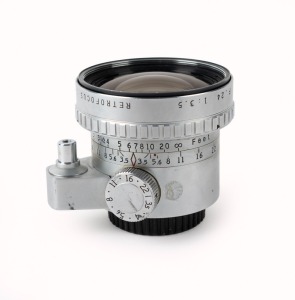 ANGÉNIEUX: Chrome P. Angénieux 24mm f3.5 Type R61 Retrofocus lens [#859160], c. 1959, with Exakta mount and rear lens cap.