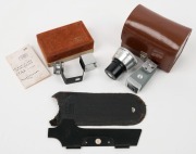 ZEISS IKON: Three accessories - one 563/03 clip-on finder for 85mm and 135mm Contax&nbsp;cameras in maker's box with instruction sheet,&nbsp;one 541/16 Film Trimming Guide in leather pouch, and one c. 1962 Movitelar&nbsp;2xf magnification filter [#4 045 973] with rear l