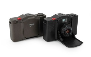 KIEV ARSENAL: Two c. 1985 Kiev 35A compact cameras - one in black with MC Korsar 35mm f2.8 lens and hot shoe cover, and one in dark grey with Kiev-Korsar 35mm f2.8 lens and hot shoe cover. Well-known Soviet copies of the Minox 35GT. (2 cameras)