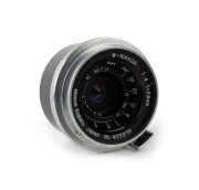 NIPPON KOGAKU: W-Nikkor&middot;C&nbsp;25mm f4 lens [#403219]&nbsp;with bayonet mount&nbsp;in chrome, c. 1953, together with metal rear lens cap.