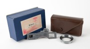 NIPPON KOGAKU: Close-Up Device metal camera attachment set [#21803], c. 1951, in maker's box with leather case. Designed for use with&nbsp;Nikkor 50mm f2 lens.