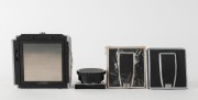 HASSELBLAD: Four camera accessories - one 1952 black and chrome 1600F camera back [#CH 14224], two waist-level viewfinders in black and chrome, and one film winding knob for C models. (4 items) - 2