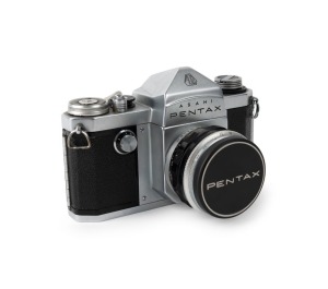 ASAHI KOGAKU: Pentax S SLR camera [#157326], c. 1958, with Takumar 55mm f2.2 lens [#156040], together with metal front lens cap.