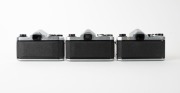 ASAHI KOGAKU: Three early 1960s chrome-body SLR cameras - one Pentax S1 [#527278] with Auto-Takumar 55mm f2.2 lens [#685818], one Pentax S1a [#667626] with Super-Takumar 55mm f2 lens [#1333211], and one Pentax S2 [#394959] with Auto-Takumar 55mm f2 lens [ - 3