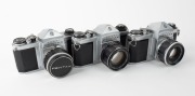 ASAHI KOGAKU: Three circa 1960 chrome-body SLR cameras - one Pentax S2 [#326638] with Auto-Takumar 55mm f2 lens [#376835], one Pentax H2 [#230641] with Auto-Takumar 55mm f2 lens [#264636] and front lens cap, and one Pentax SV [#930754] with Super-Takumar