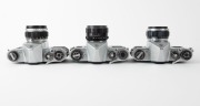 ASAHI KOGAKU: Three circa 1960 chrome-body SLR cameras - one Pentax S2 [#326638] with Auto-Takumar 55mm f2 lens [#376835], one Pentax H2 [#230641] with Auto-Takumar 55mm f2 lens [#264636] and front lens cap, and one Pentax SV [#930754] with Super-Takumar - 4