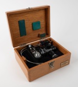 OLYMPUS: Black-body Olympus PM-6 microscope camera [#205480], c. 1954, with shutter release cable and maker's lined wooden box bearing 'Olympus Tokyo' metal stamp. - 6