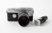 OLYMPUS: Pen FT half-frame SLR camera [#292237], c. 1966, with G. Zuiko Auto-S 40mm f1.4 lens [#165272], T-45 metal lens hood, and Pen-F straight magnifier viewfinder attachment. - 2