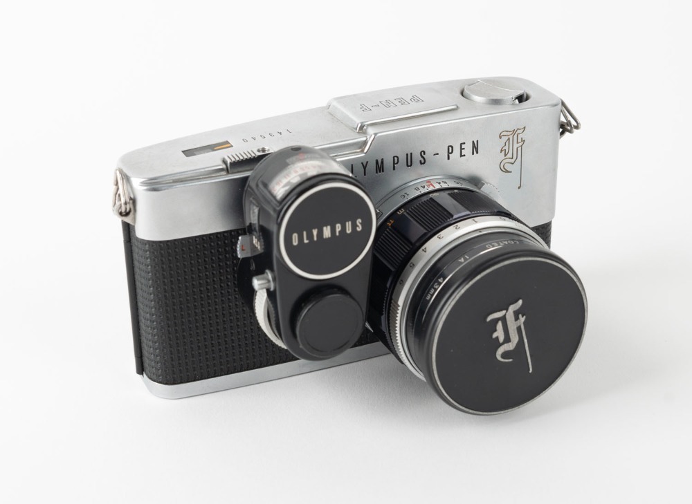 OLYMPUS: Pen F SLR camera [#149540], c. 1963, with G. Zuiko Auto-S