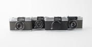 OLYMPUS: Four c. 1960s 35mm half-frame cameras - one early model Olympus Pen [#127828] with D. Zuiko 28mm f3.5 lens, one Olympus Pen S 2.8 [#383825] with D. Zuiko 30mm f2.8 lens, one Olympus Pen S 3.5 [#182599] with D. Zuiko 28mm f3.5 lens and lens cap, a - 2