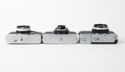 OLYMPUS: Three c. 1967 35mm half-frame cameras - one Pen-EM [#105763] with F. Zuiko 35mm f2 lens and Olympus 82C lens filter, one Pen Rapid-EE S [#100335] with D. Zuiko 30mm f2.8 lens and Olympus lens hood, and one Pen-EED [#251516] with F. Zuiko 32mm f1. - 5