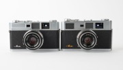 OLYMPUS: Two c. 1958 rangefinder cameras - one Olympus-Ace [#143579] with E. Zuiko 45mm f2.8 lens [#125101] and Copal-SV shutter, and one Olympus Ace-E [#116660] with E. Zuiko 45mm f2.8 lens [#159456] and Seikosha-SLV shutter. (2 cameras) - 2