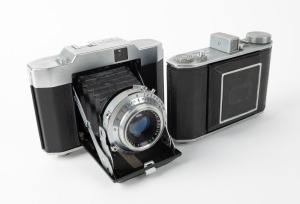 OLYMPUS: Two vertical-folding cameras - one 1948 Chrome Six I [#22296] with Zuiko 75mm f3.5 lens [#35225] and Copal shutter, and one 1955 Chrome Six Va [#172624] with D. Zuiko 75mm f3.5 lens [#140869] and Copal shutter. (2 cameras)