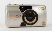 OLYMPUS: Mju Zoom 105 Deluxe L compact camera [#5796964] with gold body and lens detail, c. 1995,&nbsp;with Zoom 38-105mm lens, in maker's box with leatherette pouch, RC-200 remote control, wrist strap, and instruction booklet. - 2