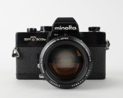 MINOLTA: Black-body Minolta SRT-303b SLR camera [#3214660], c. 1975, with MC Rokkor 58mm f1.2 lens [#2764431]. - 2