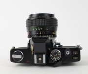 MINOLTA: Black-body Minolta SRT-303b SLR camera [#3214660], c. 1975, with MC Rokkor 58mm f1.2 lens [#2764431]. - 4