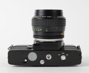MINOLTA: Black-body Minolta SRT-303b SLR camera [#3214660], c. 1975, with MC Rokkor 58mm f1.2 lens [#2764431]. - 5
