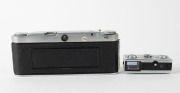 WIRGIN: Two unusual c. 1950s black-and-chrome&nbsp;cameras - one Wirgin Stereo camera with dual Cassar 35mm f3.5 lenses [#1032111 & #1034098], and one Edixa 16-S subminiature camera with Xenar 25mm f2.8 lens. (2 cameras) - 3
