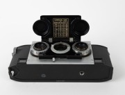WHITE: Stereo Realist Model 1041 stereo camera [#A69780], c. 1947, with dual f3.5 lenses. Unusual design with viewfinder at bottom of camera and integrated flip-up lens cap. - 2