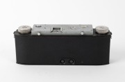 WHITE: Stereo Realist Model 1041 stereo camera [#A69780], c. 1947, with dual f3.5 lenses. Unusual design with viewfinder at bottom of camera and integrated flip-up lens cap. - 3